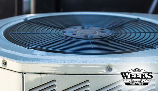 Close-up of a residential outdoor air conditioning unit.